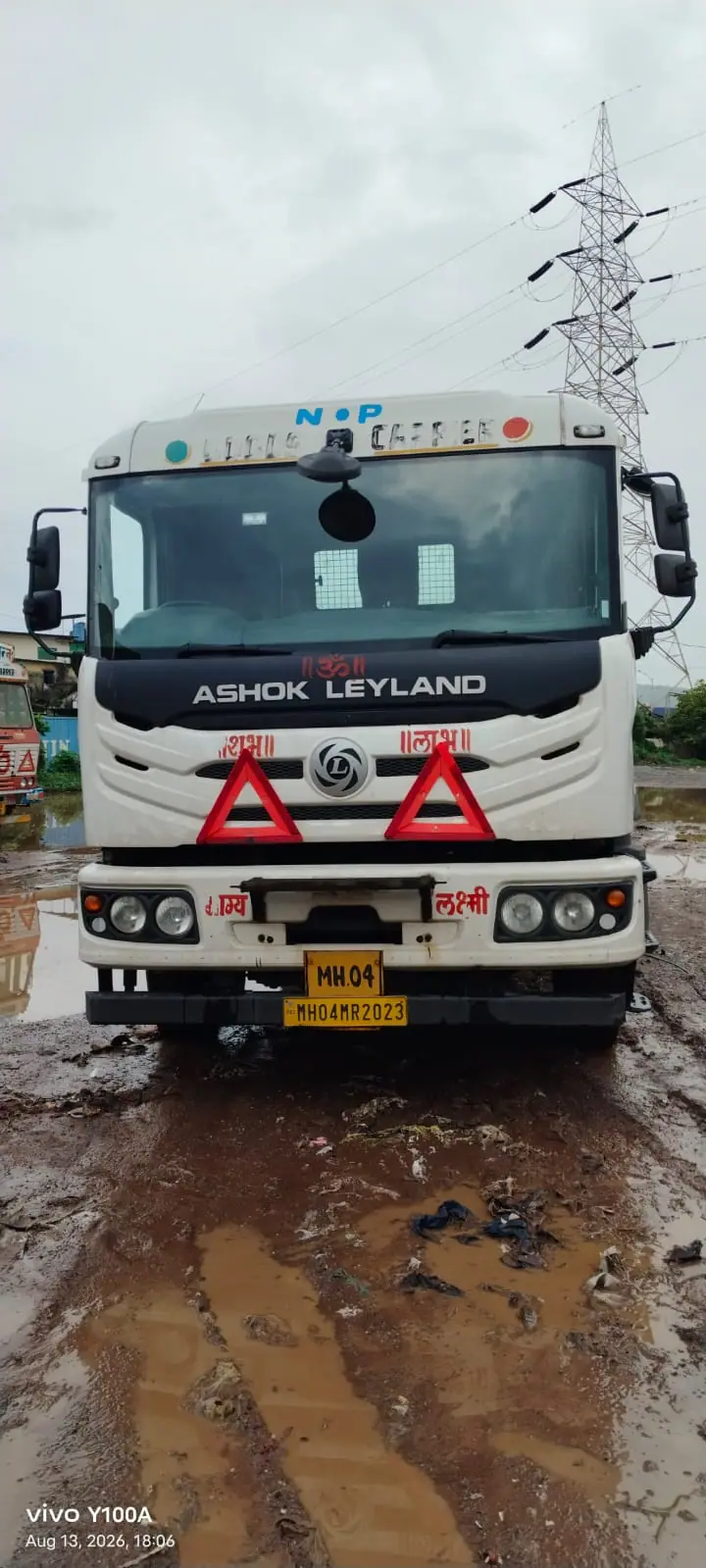 Front of a white tractor unit in a yard