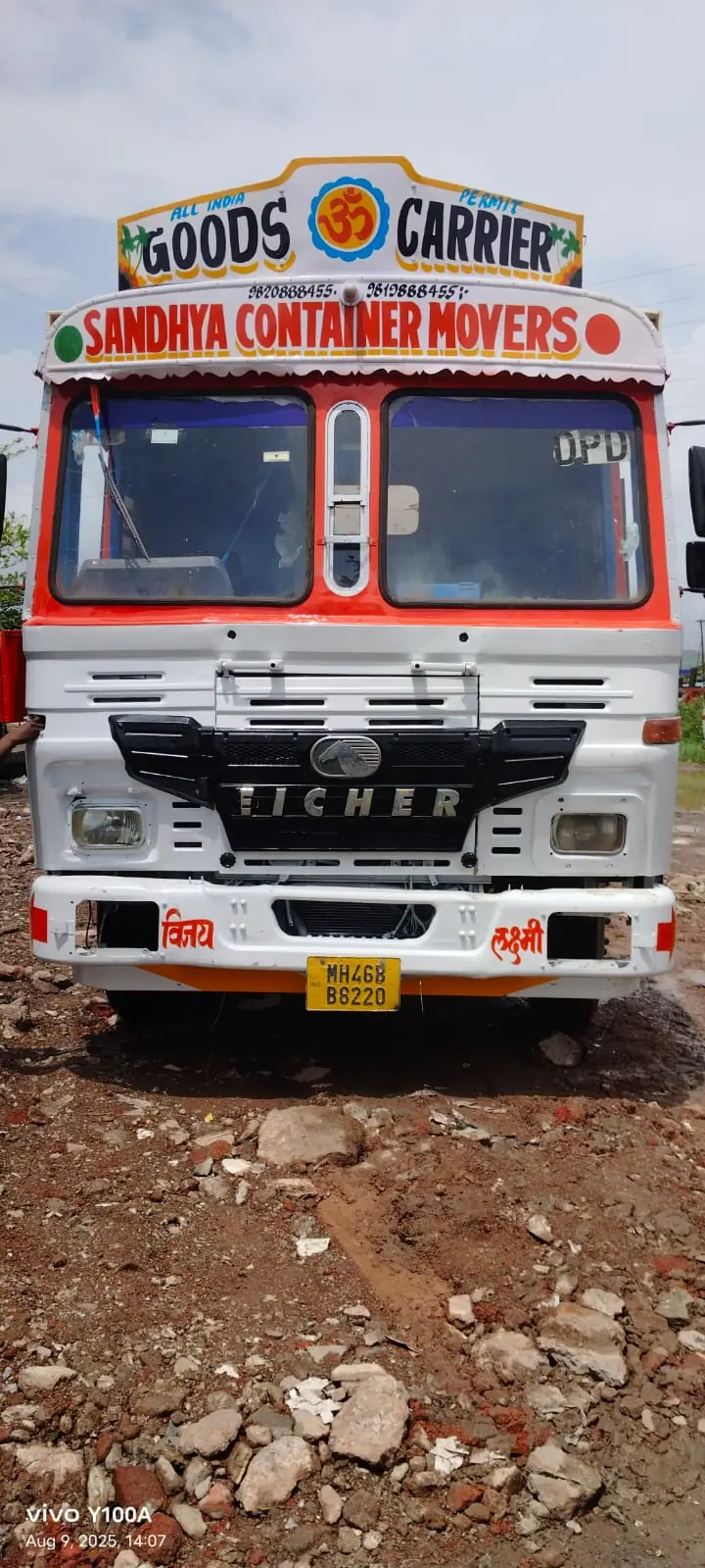 Front of a Sandhya Container Movers truck with decorated cab